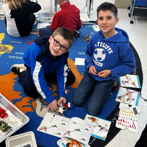 Students work together to build with legos