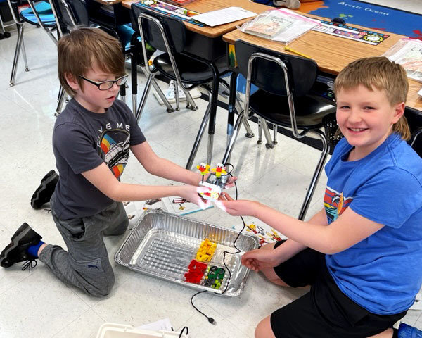 Students work together to build with legos