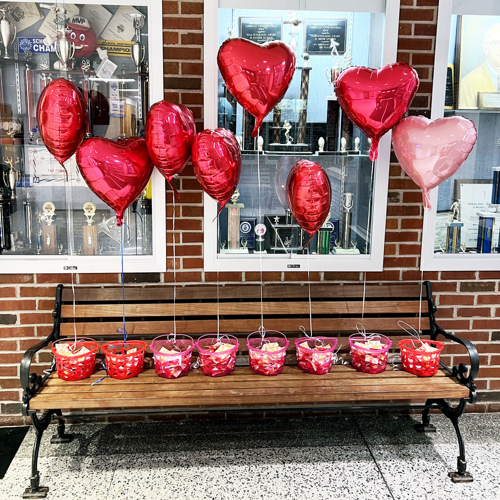 A bench holding art balloons and baskets