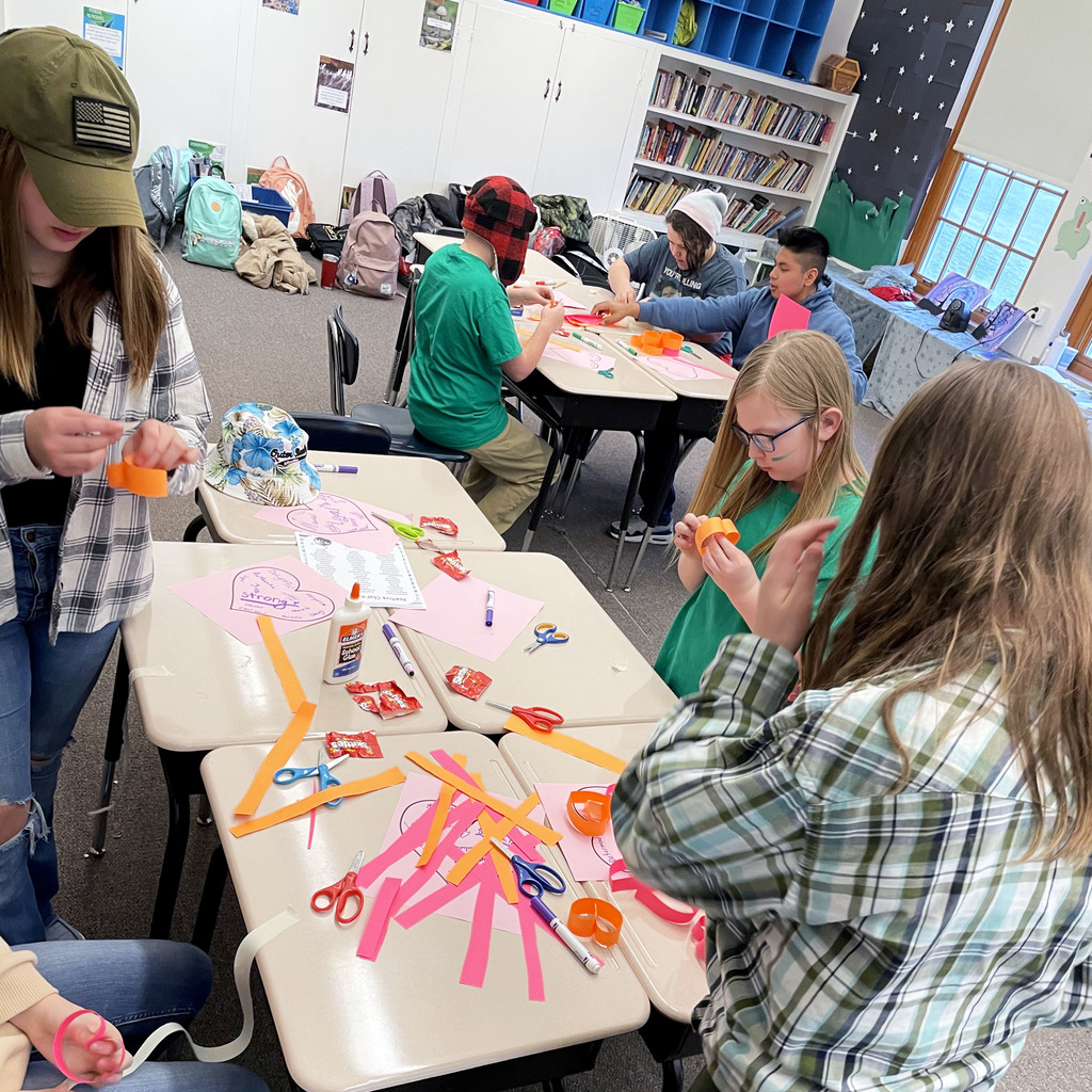 Students construct paper hearts