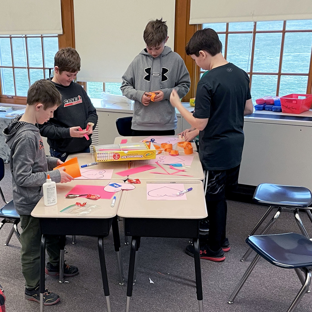 Students construct paper hearts