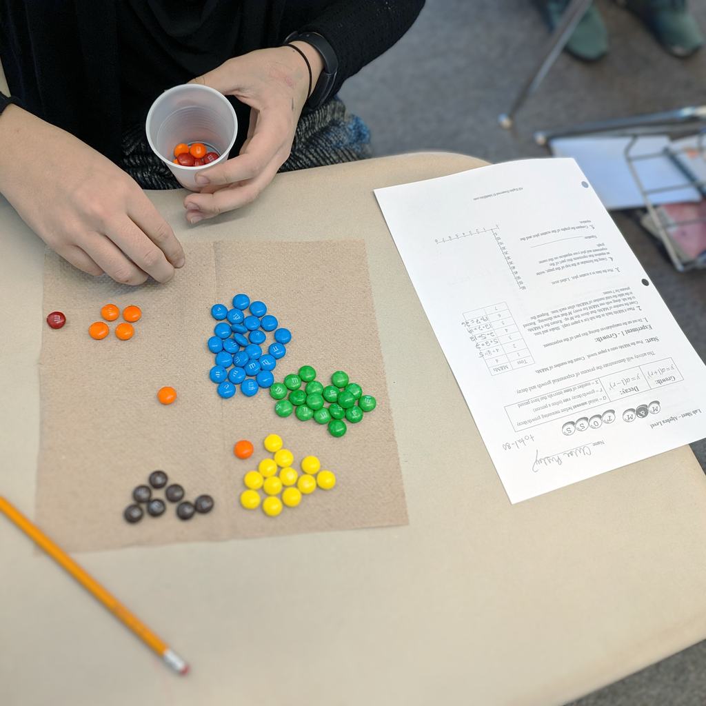 students use M&M's to learn about exponential growth and decay