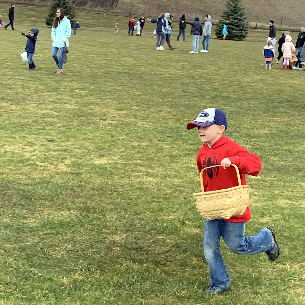 a child hunts for easter eggs