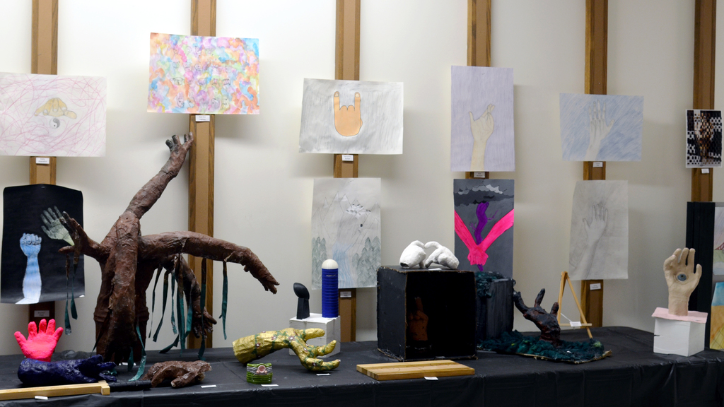 sculptures and drawings of hands