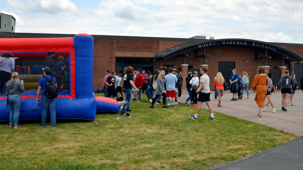 Students play on a bouncy house