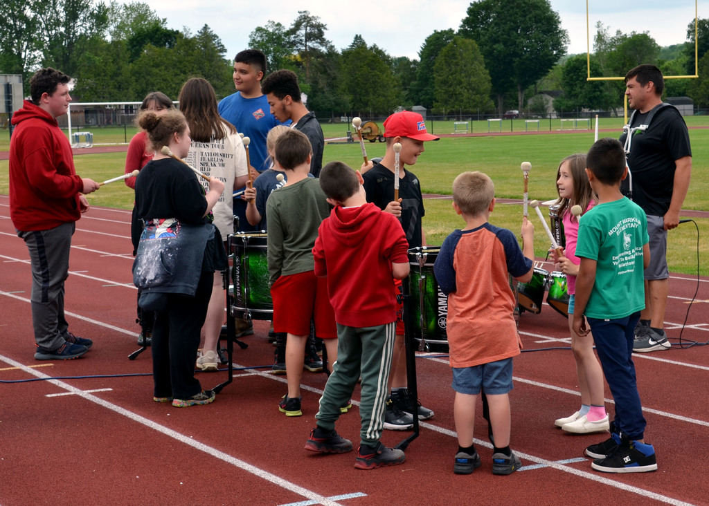 High Schoolers and second graders perform with DownBeat Percussion