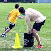 A student races with Mr. Hawes at the water bucket