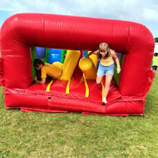 Students play in a bounce house